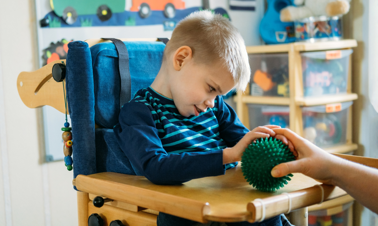 Child with OT tool