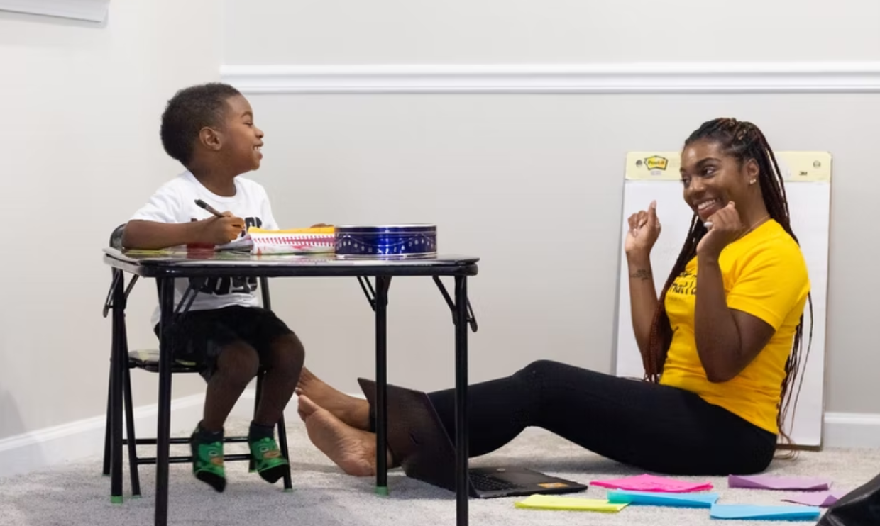 Parent helping child with schoolwork