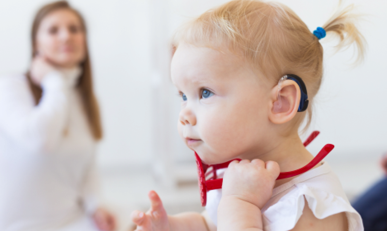Toddler with hearing aid