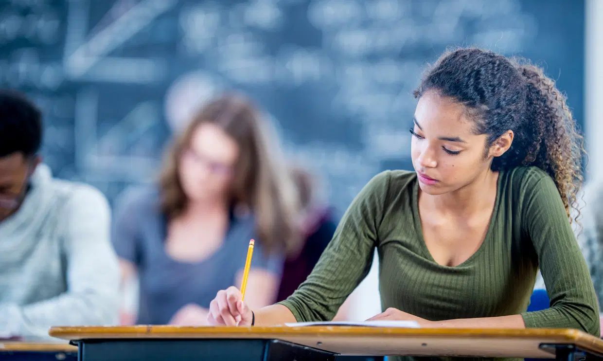 Classroom with student writing