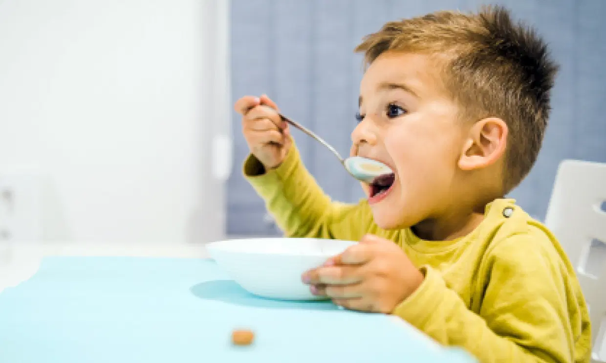 Child eating breakfast
