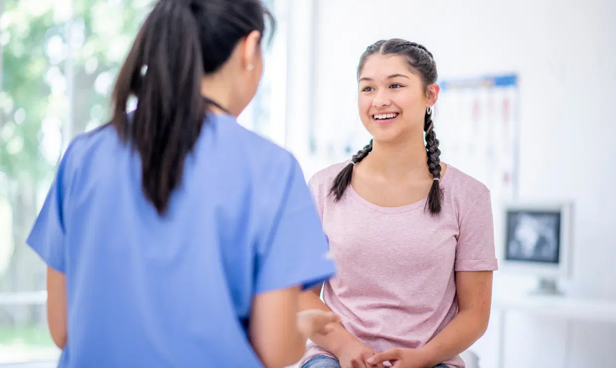 Young adult speaking with a medical professional