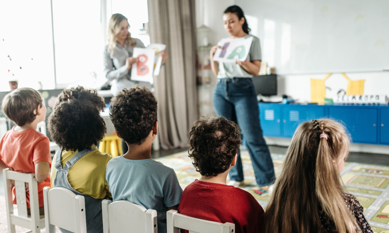 Class of students with teachers giving instructions