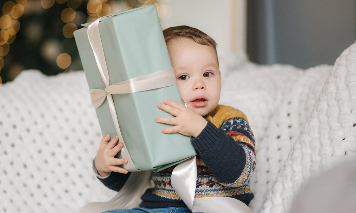 Young child holding a gift