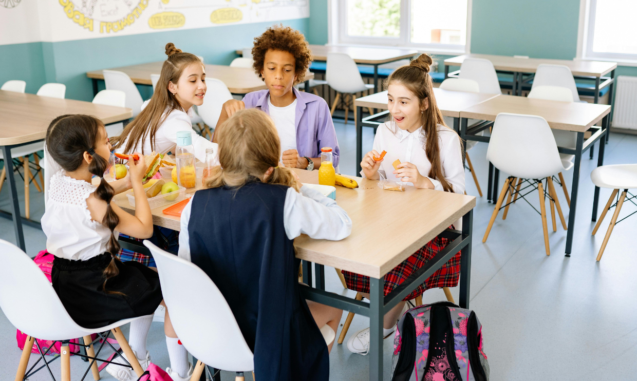 Students eating lunch at a table