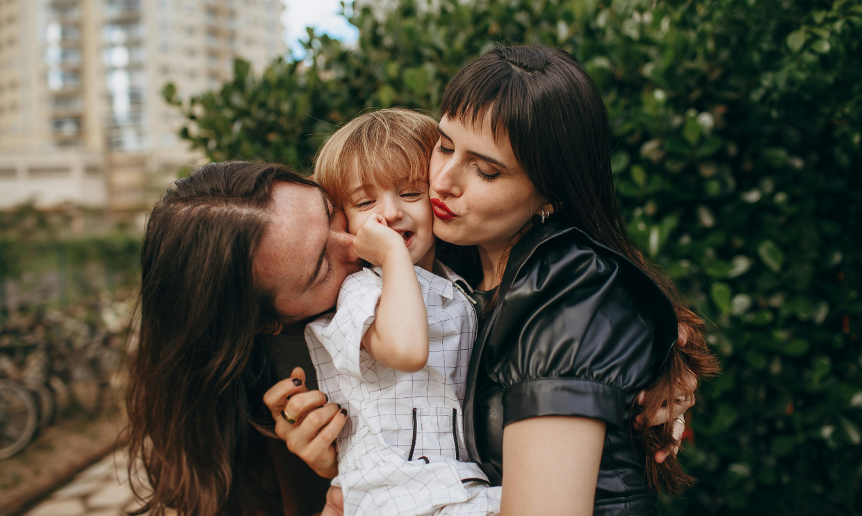parents holding a child