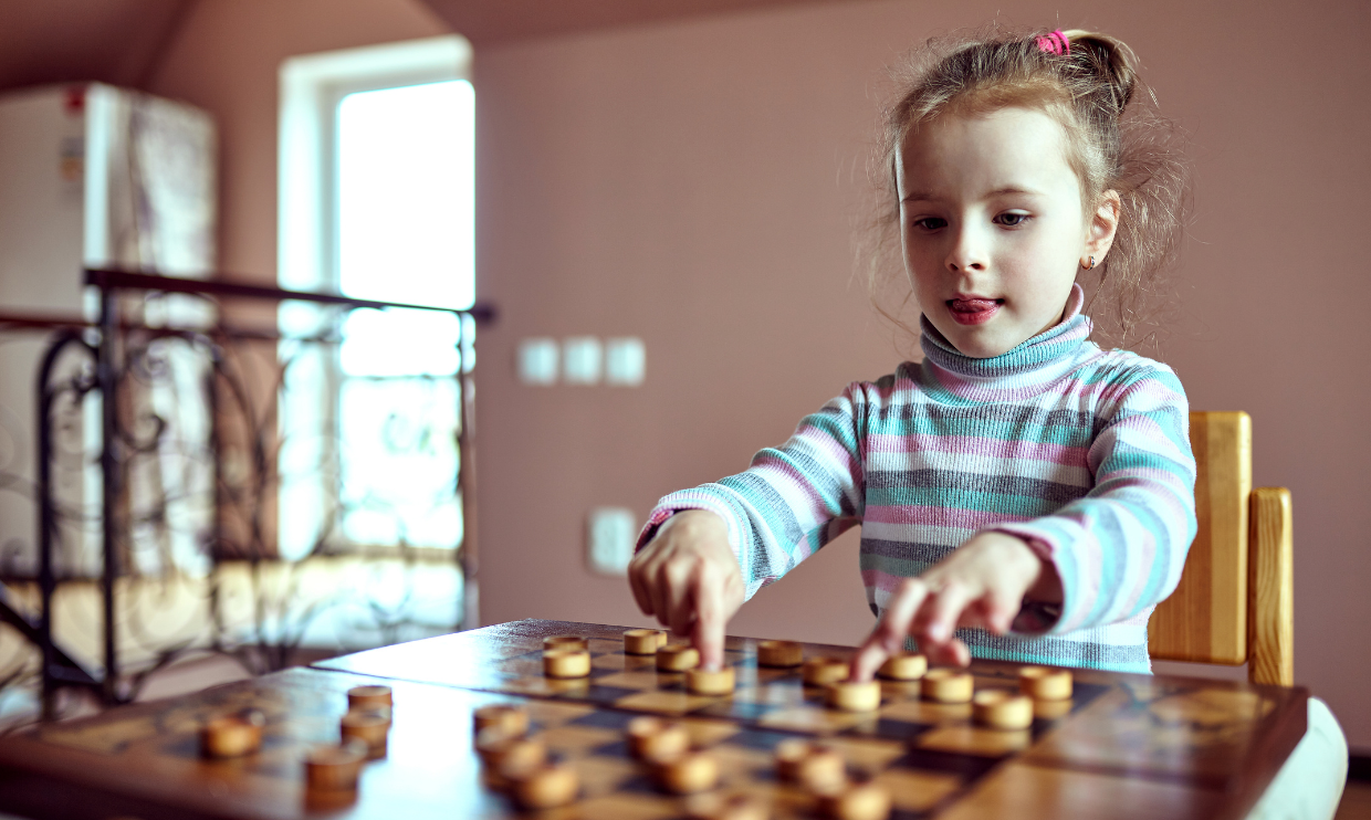 Girl playing a board game