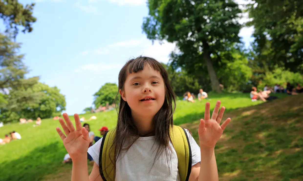 Child with disabilities outside in nice weather