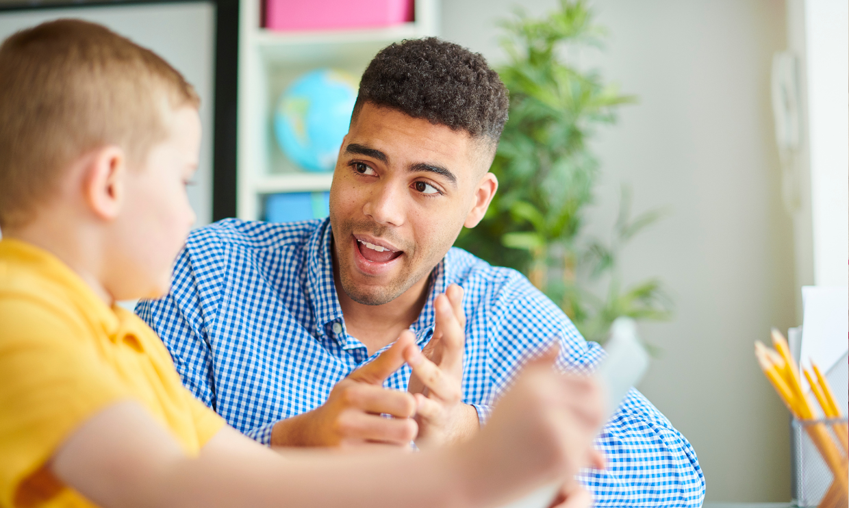 Adult helping child at school